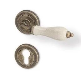 Rozetna kvaka CERAN / brončana patina - bijeli porculan